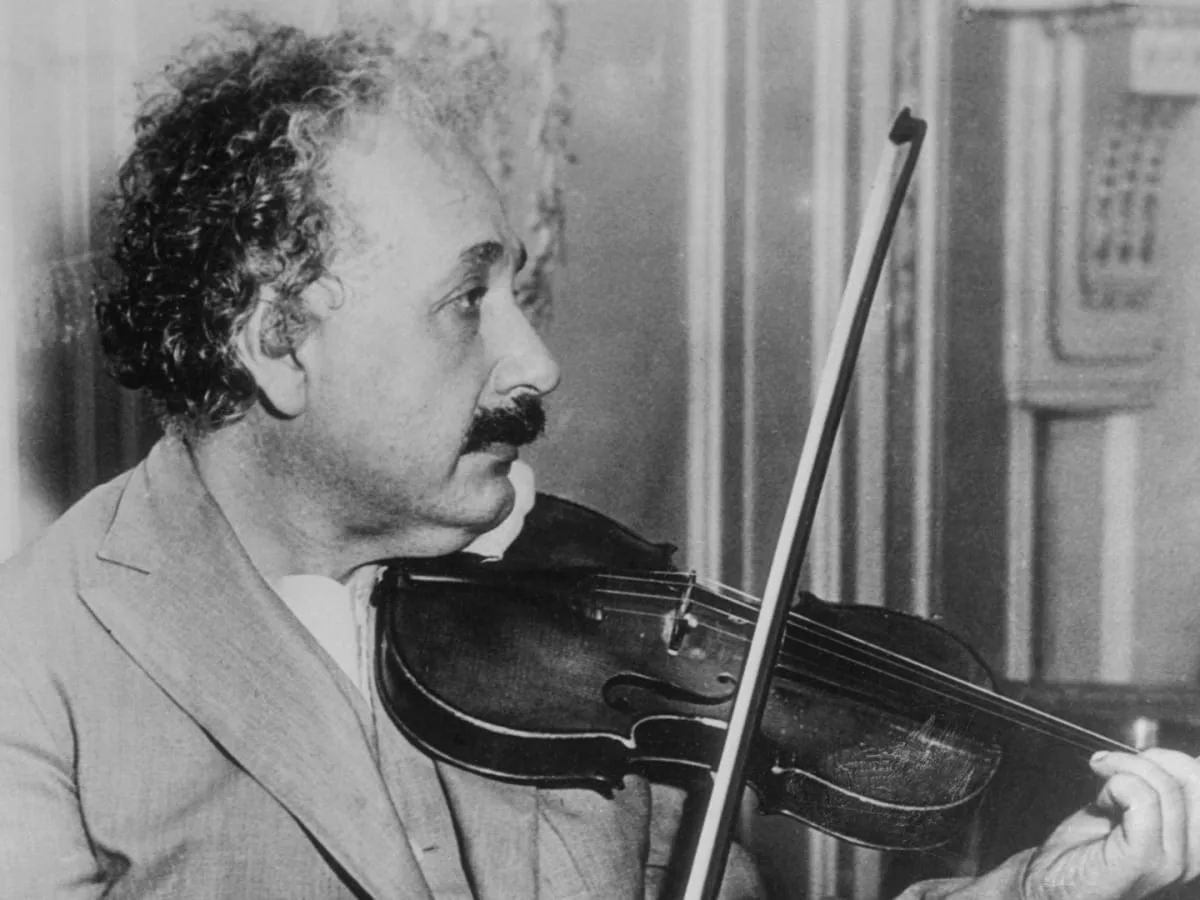 Why Did Einstein Remove his Hat in Rainy Weather?